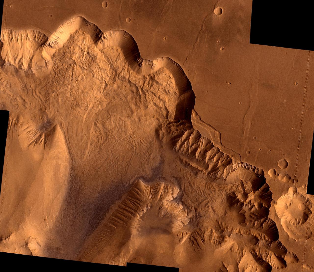 During its examination of Mars, NASA's Viking 1 spacecraft returned images of Valles Marineris, a huge canyon system 5,000 km long, up to 240 km wide, and 6.5 km deep, whose connected chasma or valleys may have formed from a combination of erosional collapse and structural activity. This synthetic oblique view shows Ophir Chasma, the northern most one of the connected valleys of Valles Marineris; north toward top of frame; for scale, the large impact crater in lower right corner is 30 km (18 miles) wide. This point-perspective, digital image, centered at latitude 4 degrees S., longitude 71 degrees, is a composite of Viking 1 Orbiter high-resolution (about 80 m/pixel or picture element) images in black and white and low-resolution (about 250 m/pixel) images in color; no vertical exaggeration. The Viking 1 craft landed on Mars in July of 1976. Ophir Chasma is a large west-northwest-trending trough about 100 km wide. The Chasma is bordered by 4 km high walled cliffs, most likely faults, that show spur-and-gully morphology and smooth sections. The walls have been dissected by landslides forming reentrants; one area (upper left) on the north wall shows a young landslide about 100 km wide. The volume of the landslide debris is more than 1000 times greater than that from the May 18, 1980 debris avalanche from Mount St. Helens. The longitudinal grooves seen in the foreground are thought to be due to differential shear and lateral spreading at high velocities. The landslide passes between mounds of interior layered deposits on the floor of the chasma. http://photojournal.jpl.nasa.gov/catalog/PIA00425