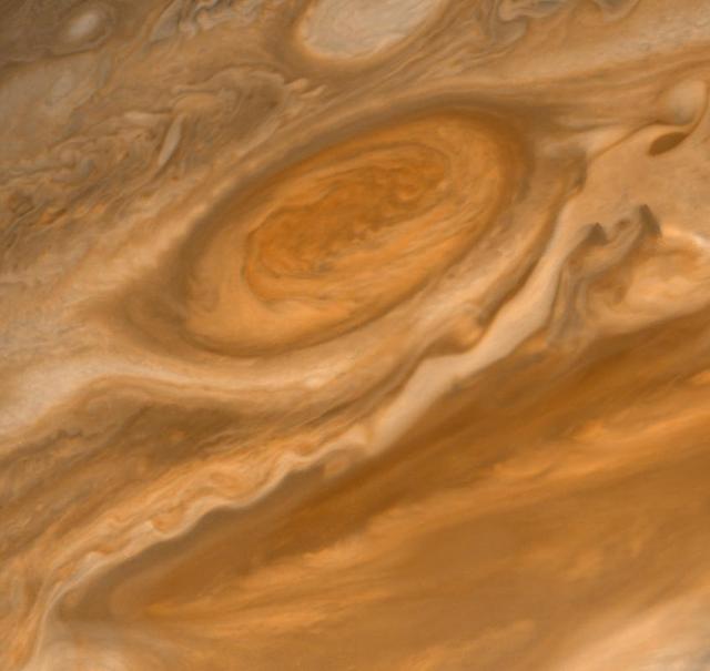 NASA Voyager 2 shows the Great Red Spot and the south equatorial belt extending into the equatorial region. At right is an interchange of material between the south equatorial belt and the equatorial zone. The clouds in the equatorial zone are more diffuse and do not display the structures seen in other locations. Considerable structure is evident within the Great Red Spot.   http://photojournal.jpl.nasa.gov/catalog/PIA00456