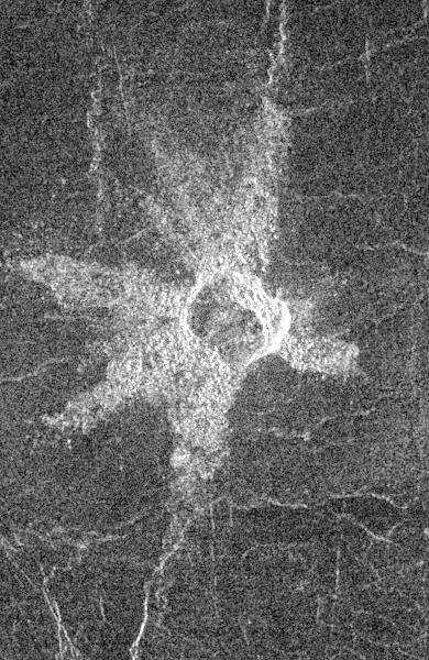 This image from NASA Magellan spacecraft shows the central Eistla Region of the equatorial highlands of Venus. It is centered at 15 degrees north latitude and 5 degrees east longitude. The image is 76.8 kilometers (48 miles) wide. The crater is slightly irregular in platform and approximately 6 kilometers (4 miles) in diameter. The walls appear terraced. Five or six lobes of radar-bright ejecta radiate up to 13.2 kilometers (8 miles) from the crater rim. These lobes are up to 3.5 kilometers (2 miles) in width and form a "starfish" pattern against the underlying radar-dark plains. The asymmetric pattern of the ejecta suggests the angle of impact was oblique. The alignment of two of the ejecta lobes along fractures in the underlying plains is apparently coincidental.   http://photojournal.jpl.nasa.gov/catalog/PIA00466
