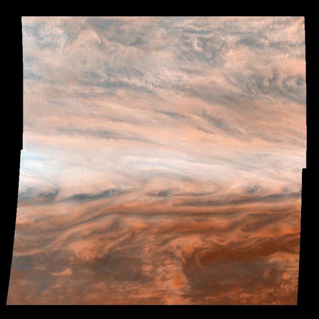 Pseudo-true color mosaic of a belt-zone boundary near Jupiter equator. The images that make up the four quadrants of this mosaic were taken within a few minutes of each other by NASA Galileo orbiter.
