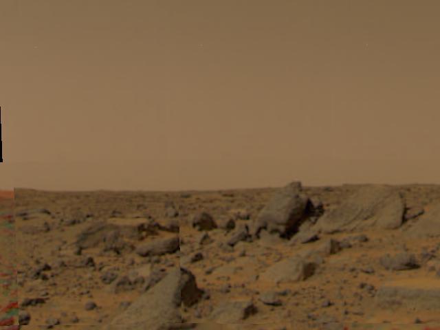 Large boulders are visible in this enlargement of pictures taken by the Imager for Mars Pathfinder (IMP) lander camera on July 4, 1997. The landing site is in the dry flood channel named Ares Valles. The boulders probably represent deposits from one of the catastrophic floods that carved the ancient channel. Between the rocks is brownish windblown soil. The gray-tan sky results from dust particles in the atmosphere.  http://photojournal.jpl.nasa.gov/catalog/PIA00609