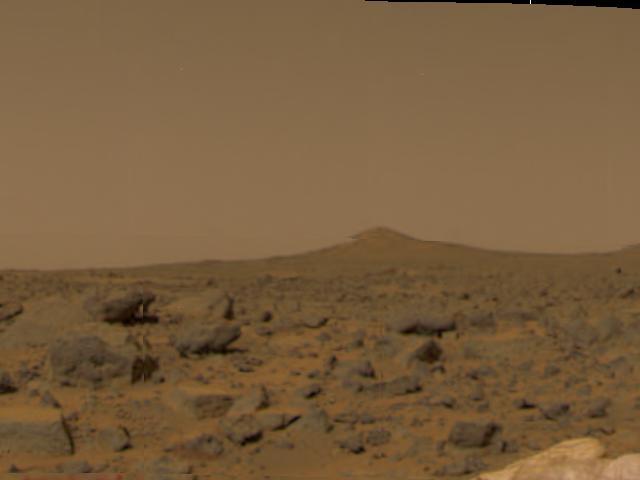 This image of the Martian surface was taken in the afternoon of Mars Pathfinder's first day on Mars. Taken by the Imager for Mars Pathfinder (IMP camera), the image shows a diversity of rocks strewn in the foreground. A hill is visible in the distance (the notch within the hill is an image artifact). Airbags are seen at the lower right.  http://photojournal.jpl.nasa.gov/catalog/PIA00612