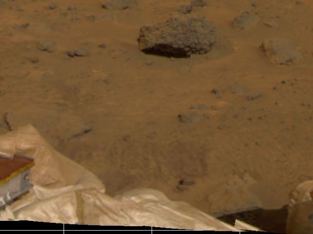 Several objects have been imaged by the Imager for Mars Pathfinder (IMP) during the spacecraft's first day on Mars. Portions of the deflated airbags, part of one the lander's petals, soil, and several rocks are visible. The furrows in the soil were artificially produced by the retraction of the airbags after landing, which occurred at 10:07 a.m. PDT.  http://photojournal.jpl.nasa.gov/catalog/PIA00616