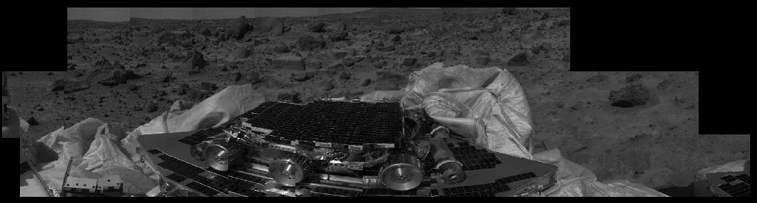 This image shows that the Mars Pathfinder airbags have been successfully retracted, allowing safe deployment of the rover ramps. The Sojourner rover, still in its deployed position, is at center image, and rocks are visible in the background. Mars Pathfinder landed successfully on the surface of Mars today at 10:07 a.m. PDT.  http://photojournal.jpl.nasa.gov/catalog/PIA00617