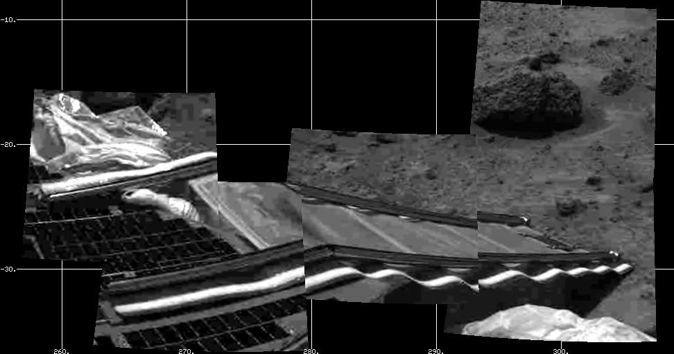 NASA's Mars Pathfinder's rear rover ramp can be seen successfully unfurled in this image, taken at the end of Sol 2 by the Imager for Mars Pathfinder (IMP). This ramp was later used for the deployment of the microrover Sojourner, which occurred at the end of Sol 2. Areas of a lander petal and deflated airbag are visible at left. The image helped Pathfinder scientists determine that the rear ramp was the one to use for rover deployment. At upper right is the rock dubbed "Barnacle Bill," which Sojourner will later study.  http://photojournal.jpl.nasa.gov/catalog/PIA00627