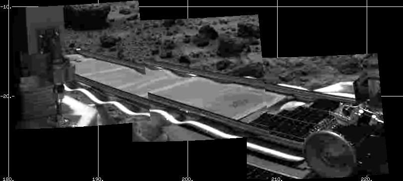 Mars Pathfinder's forward rover ramp can be seen successfully unfurled in this image, taken at the end of Sol 2 by the Imager for Mars Pathfinder (IMP). This ramp was not used for the deployment of the microrover Sojourner, which occurred at the end of Sol 2. Sojourner can be seen still latched to one of the lander's petals, waiting for the command sequence that would execute its descent off of the lander's petal. The imager helped Pathfinder scientists determine whether to deploy the rover using the forward or backward ramps and the nature of the first rover traverse.  http://photojournal.jpl.nasa.gov/catalog/PIA00628