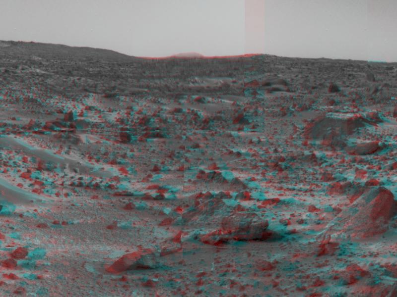 NASA Mars Pathfinder forward rover ramp can be seen successfully unfurled in this image, taken in stereo by the Imager camera. The large rock dubbed Wedge is at lower right. 3-D glasses are necessary to identify surface detail.