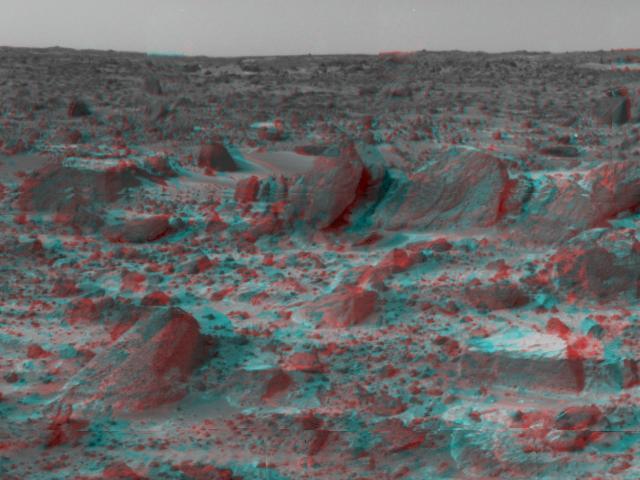 Many prominent rocks near the Sagan Memorial Station are featured in this image from NASA Mars Pathfinder. Shark, Half-Dome, and Pumpkin are at center 3D glasses are necessary to identify surface detail. 