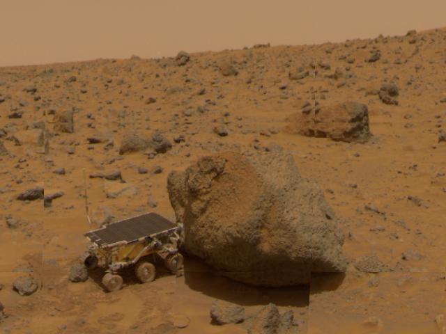 This 1997 image from NASA Mars Pathfinder shows a close up of Sojourner as it placed its Alpha Proton X-Ray Spectrometer APXS upon the surface of the rock Yogi.  