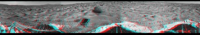 This 360-degree panorama was taken by NASA Mars Pathfinder. Three petals and the perimeter of the deflated airbags are seen in the foreground. 3D glasses are necessary to identify surface detail. 