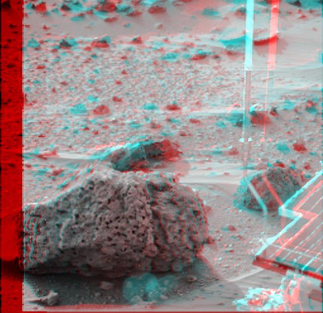 Barnacle Bill is a small rock immediately west-northwest of NASA Mars Pathfinder lander and was the first rock visited by the rover Sojourner. 3D glasses are necessary to identify surface detail. 
