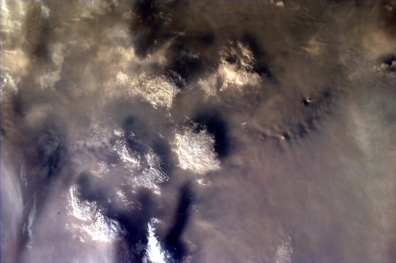 As the Space Shuttle Atlantis flew over the Indonesian archipelago on Saturday, Sept. 27, 1997, middle school students across the country used NASA Kidsat camera to photograph the fires and smoke that blanket the island of Sumatra.