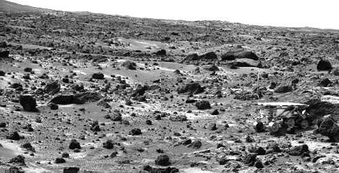 This image taken on the morning of Sol 80 (September 23) shows the Sojourner rover with its Alpha Proton X-ray Spectrometer (APXS) deployed against the rock "Chimp." On the left horizon is the rim of "Big Crater," 2.2 km away. Sojourner spent 83 days of a planned seven-day mission exploring the Martian terrain, acquiring images, and taking chemical, atmospheric and other measurements. The final data transmission received from Pathfinder was at 10:23 UTC on September 27, 1997. Although mission managers tried to restore full communications during the following five months, the successful mission was terminated on March 10, 1998. http://photojournal.jpl.nasa.gov/catalog/PIA00970