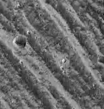 Bright and Dark Slopes on Ganymede