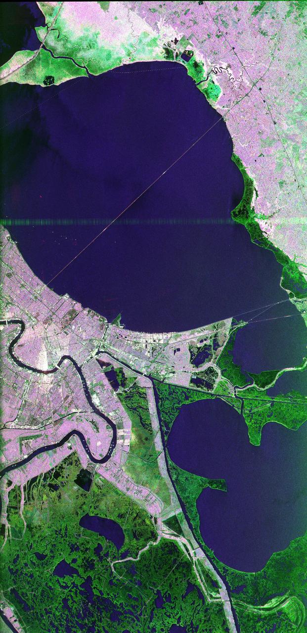 This image of the area surrounding the city of New Orleans, Louisiana in the southeastern United States demonstrates the ability of multi-frequency imaging radar to distinguish different types of land cover. The dark area in the center is Lake Pontchartrain. The thin line running across the lake is a causeway connecting New Orleans to the city of Mandeville. Lake Borgne is the dark area in the lower right of the image. The Mississippi River appears as a dark, wavy line in the lower left. The white dots on the Mississippi are ships. The French Quarter is the brownish square near the left center of the image. Lakefront Airport, a field used mostly for general aviation, is the bright spot near the center, jutting out into Lake Pontchartrain. The image was acquired by the Spaceborne Imaging Radar C/X-Band Synthetic Aperture Radar (SIR-C/X-SAR) during orbit 39 of space shuttle Endeavour on October 2, 1994. The area is located at 30.10 degrees north latitude and 89.1 degrees west longitude. The area shown is approximately 100 kilometers (60 miles) by 50 kilometers (30 miles). The colors in this image were obtained using the following radar channels: red represents the L-band (horizontally transmitted and received); green represents the C-band (horizontally transmitted and received); blue represents the L-band (vertically transmitted and received). The green areas are primarily vegetation consisting of swamp land and swamp forest (bayou) growing on sandy soil, while the pink areas are associated with reflections from buildings in urban and suburban areas. Different tones and colors in the vegetation areas will be studied by scientists to see how effective imaging radar data is in discriminating between different types of wetlands. Accurate maps of coastal wetland areas are important to ecologists studying wild fowl and the coastal environment.   http://photojournal.jpl.nasa.gov/catalog/PIA01300