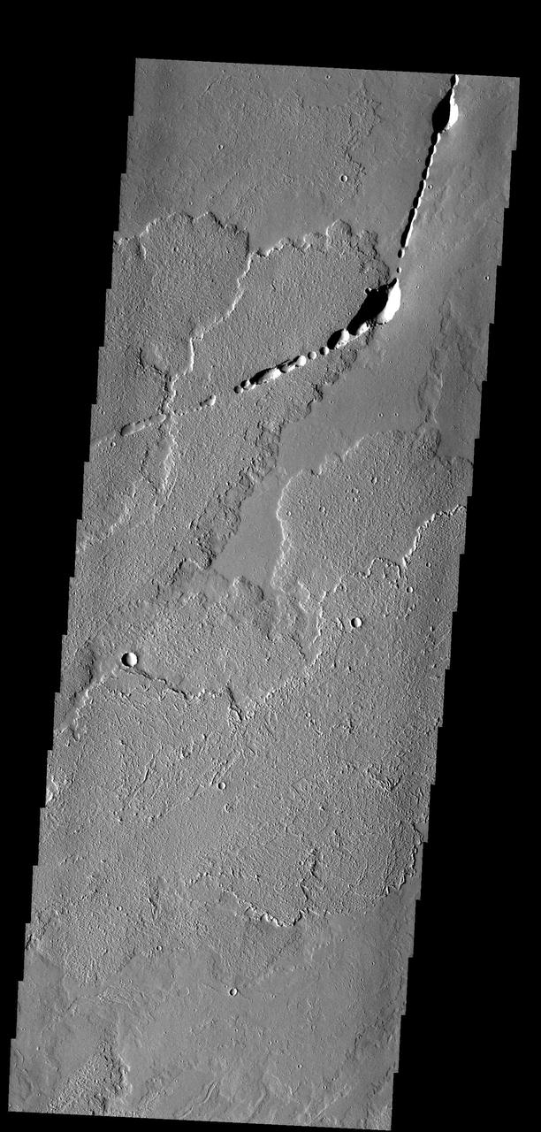 These lava flows and collapse features are part of Ascraeus Mons