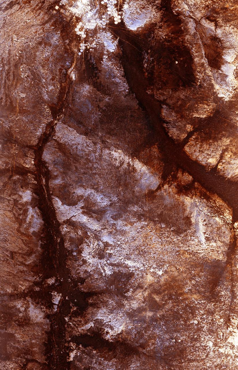 The ability of a sophisticated radar instrument to image large regions of the world from space, using different frequencies that can penetrate dry sand cover, produced the discovery in this image: a previously unknown branch of an ancient river, buried under thousands of years of windblown sand in a region of the Sahara Desert in North Africa. This area is near the Kufra Oasis in southeast Libya, centered at 23.3 degrees north latitude, 22.9 degrees east longitude. The image was acquired by the Spaceborne Imaging Radar-C/X-band Synthetic Aperture (SIR-C/X-SAR) imaging radar when it flew aboard the space shuttle Endeavour on its 60th orbit on October 4, 1994. This SIR-C image reveals a system of old, now inactive stream valleys, called "paleodrainage systems,   http://photojournal.jpl.nasa.gov/catalog/PIA01310