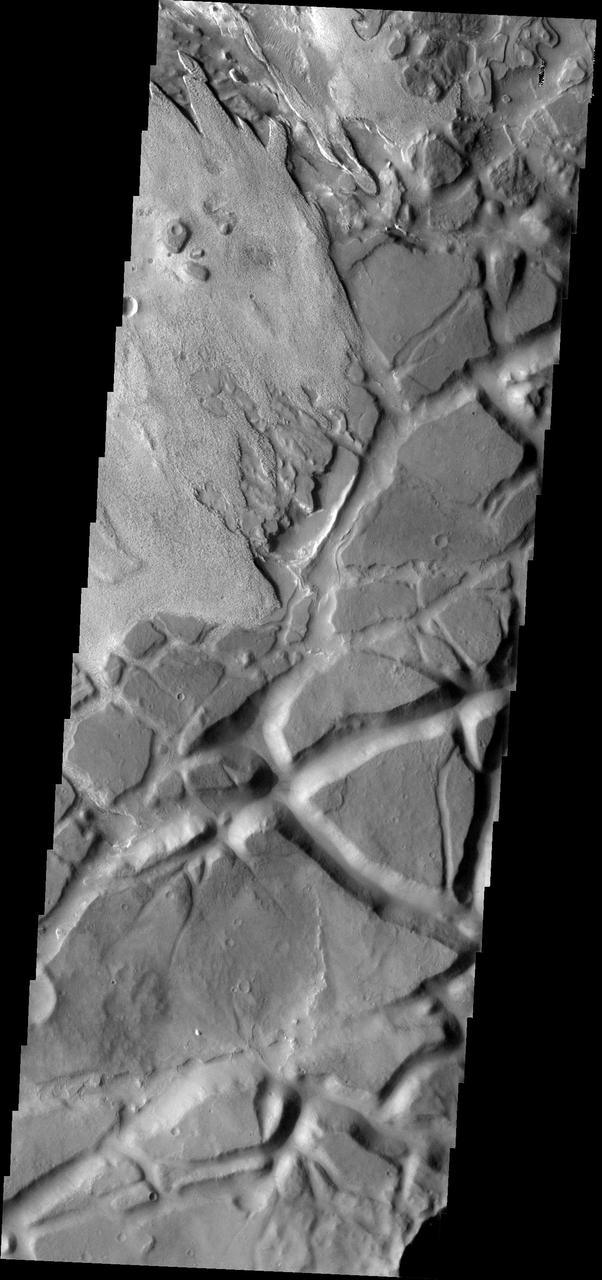 Aram Chaos is a complex region which contains layered material with different surface textures and heavily fractured material forming chaos as seen by NASA's Mars Odyssey. Image information: VIS instrument. Latitude 1.7N, Longitude 340.0E. 18 meter/pixel resolution. http://photojournal.jpl.nasa.gov/catalog/PIA01327