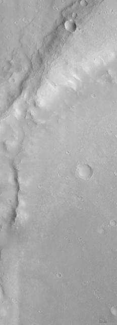 Eroded Crater Adjacent to Huygens Impact Basin