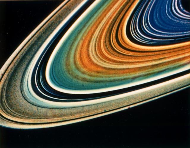 Possible variations in chemical composition from one part of Saturn ring system to another are visible in this archival image from NASA Voyager 2.