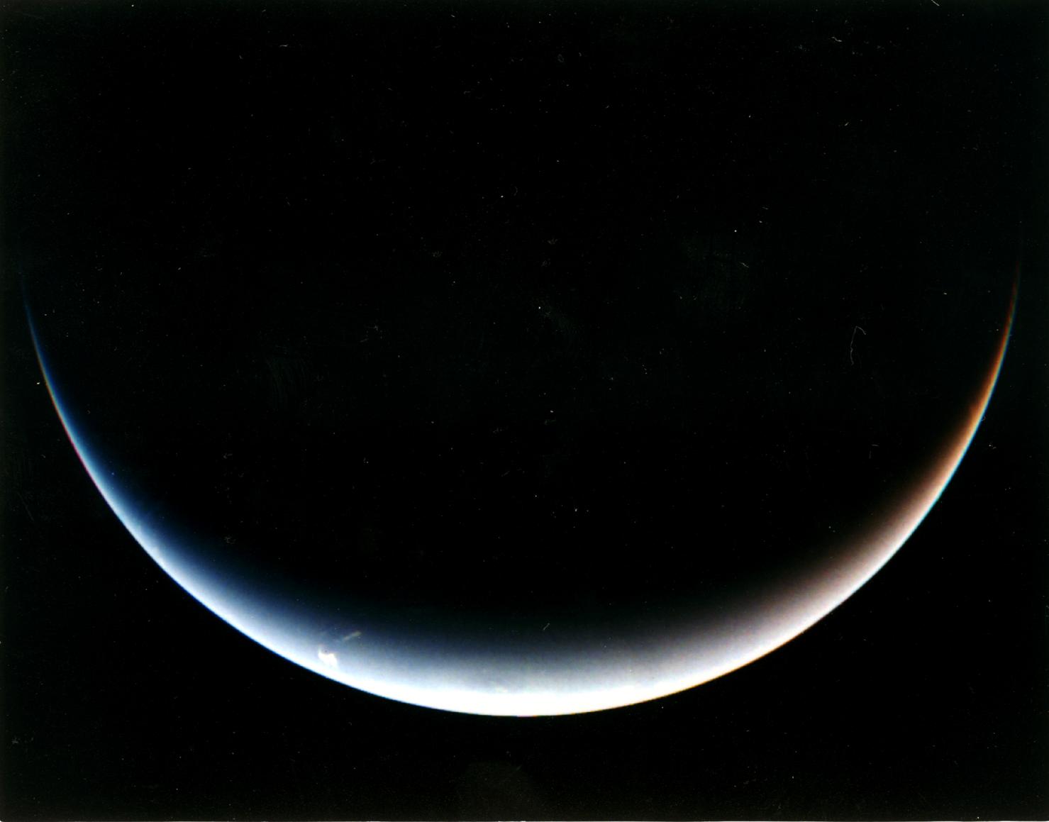 NASA Voyager 2 post-encounter view of Neptune south pole as the spacecraft sped away on a southward trajectory.