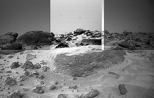 This image of the rock "Flat Top" was taken from the left of the Sojourner rover's front cameras on Sol 42. Pits on the edge of the rock and a fluted surface are clearly visible. The rocks in the left background comprise the Rock Garden.  Sojourner spent 83 days of a planned seven-day mission exploring the Martian terrain, acquiring images, and taking chemical, atmospheric and other measurements. The final data transmission received from Pathfinder was at 10:23 UTC on September 27, 1997. Although mission managers tried to restore full communications during the following five months, the successful mission was terminated on March 10, 1998. http://photojournal.jpl.nasa.gov/catalog/PIA01554