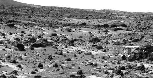 This image taken on the morning of Sol 80 (September 23, 1997) shows the Sojourner rover with its Alpha Proton X-ray Spectrometer (APXS) deployed against the rock "Chimp." On the left horizon is the rim of "Big Crater," 2.2 km away. Sojourner spent 83 days of a planned seven-day mission exploring the Martian terrain, acquiring images, and taking chemical, atmospheric and other measurements. The final data transmission received from Pathfinder was at 10:23 UTC on September 27, 1997. Although mission managers tried to restore full communications during the following five months, the successful mission was terminated on March 10, 1998. http://photojournal.jpl.nasa.gov/catalog/PIA01585