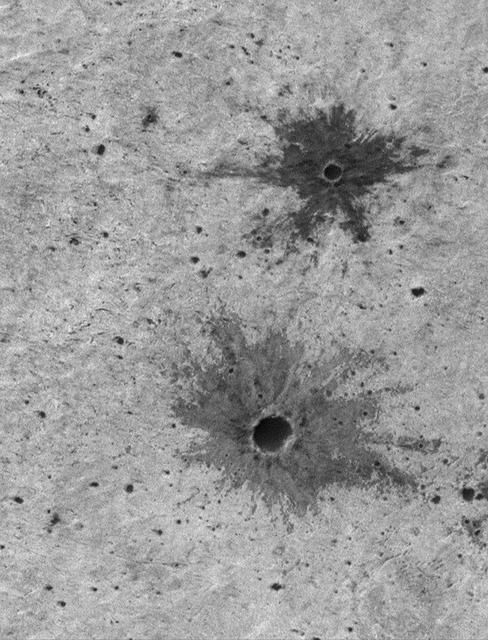 NASA image: Small Impact Craters with Dark Ejecta Deposits