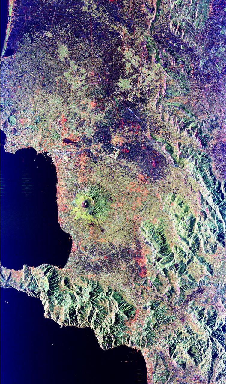 Mt. Vesuvius, one of the best known volcanoes in the world primarily for the eruption that buried the Roman city of Pompeii, is shown in the center of this radar image. The central cone of Vesuvius is the dark purple feature in the center of the volcano. This cone is surrounded on the northern and eastern sides by the old crater rim, called Mt. Somma. Recent lava flows are the pale yellow areas on the southern and western sides of the cone. Vesuvius is part of a large volcanic zone which includes the Phalagrean Fields, the cluster of craters seen along the left side of the image. The Bay of Naples, on the left side of the image, is separated from the Gulf of Salerno, in the lower left, by the Sorrento Peninsula. Dense urban settlement can be seen around the volcano. The city of Naples is above and to the left of Vesuvius; the seaport of the city can be seen in the top of the bay. Pompeii is located just below the volcano on this image. The rapid eruption in 79 A.D. buried the victims and buildings of Pompeii under several meters of debris and killed more than 2,000 people. Due to the violent eruptive style and proximity to populated areas, Vesuvius has been named by the international scientific community as one of fifteen Decade Volcanoes which are being intensively studied during the 1990s.  The image is centered at 40.83 degrees North latitude, 14.53 degrees East longitude. It shows an area 100 kilometers by 55 kilometers (62 miles by 34 miles.) This image was acquired on April 15, 1994 by the Spaceborne Imaging Radar-C/X-Band Synthetic Aperture Radar (SIR-C/X-SAR) aboard the Space Shuttle Endeavour. SIR-C/X-SAR, a joint mission of the German, Italian and the United States space agencies, is part of NASA's Mission to Planet Earth.   http://photojournal.jpl.nasa.gov/catalog/PIA01780