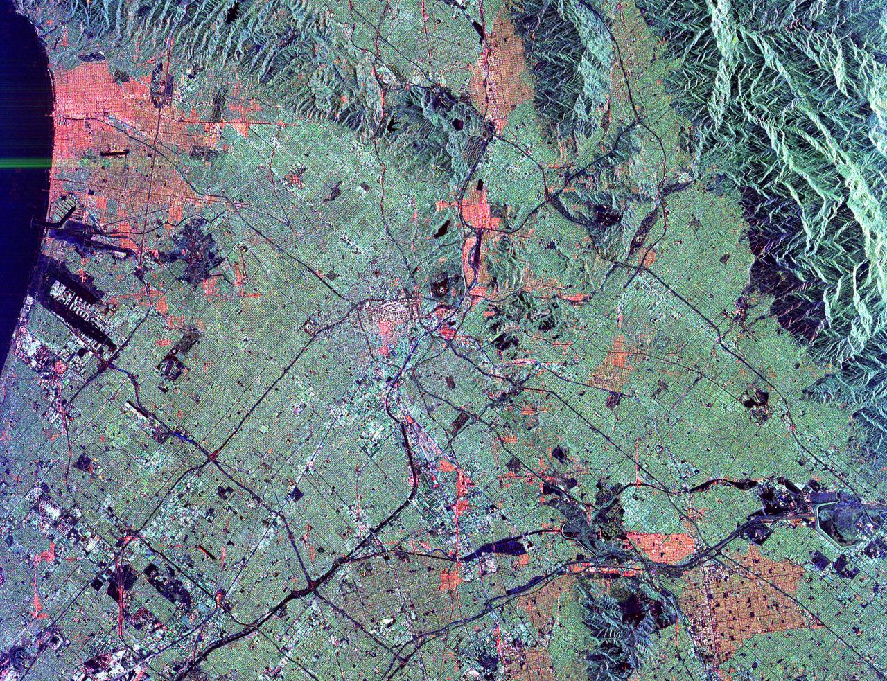 This radar image shows the massive urbanization of Los Angeles, California. The image extends from the Santa Monica Bay at the left to the San Gabriel Mountains at the right. Downtown Los Angeles is in the center of the image. The runways of the Los Angeles International Airport appear as black strips at the left center of the image. The waterways of Marina del Rey are seen just above the airport. The San Gabriel Mountains and the city of Pasadena are at the right center of the image. Black areas on the mountains on the right are fire scars from the 1993 Altadena fire. The Rose Bowl is shown as a small circle near the right center. The complex freeway system is visible as dark lines throughout the image. Some city areas, such as Santa Monica in the upper left, appear red due to the alignment of streets and buildings to the incoming radar beam.  The image was acquired by the Spaceborne Imaging Radar-C/X-band Synthetic Aperture Radar (SIR-C/X-SAR) onboard the space shuttle Endeavour on October 3, 1994. SIR-C/X-SAR, a joint mission of the German, Italian and the United States space agencies, is part of NASA's Mission to Planet Earth. This image is centered at 34.04 degrees North latitude and 118.2 degrees West longitude with North pointing toward the upper right. The area shown measures 40 kilometers by 50 kilometers (25 miles by 31 miles).   http://photojournal.jpl.nasa.gov/catalog/PIA01789