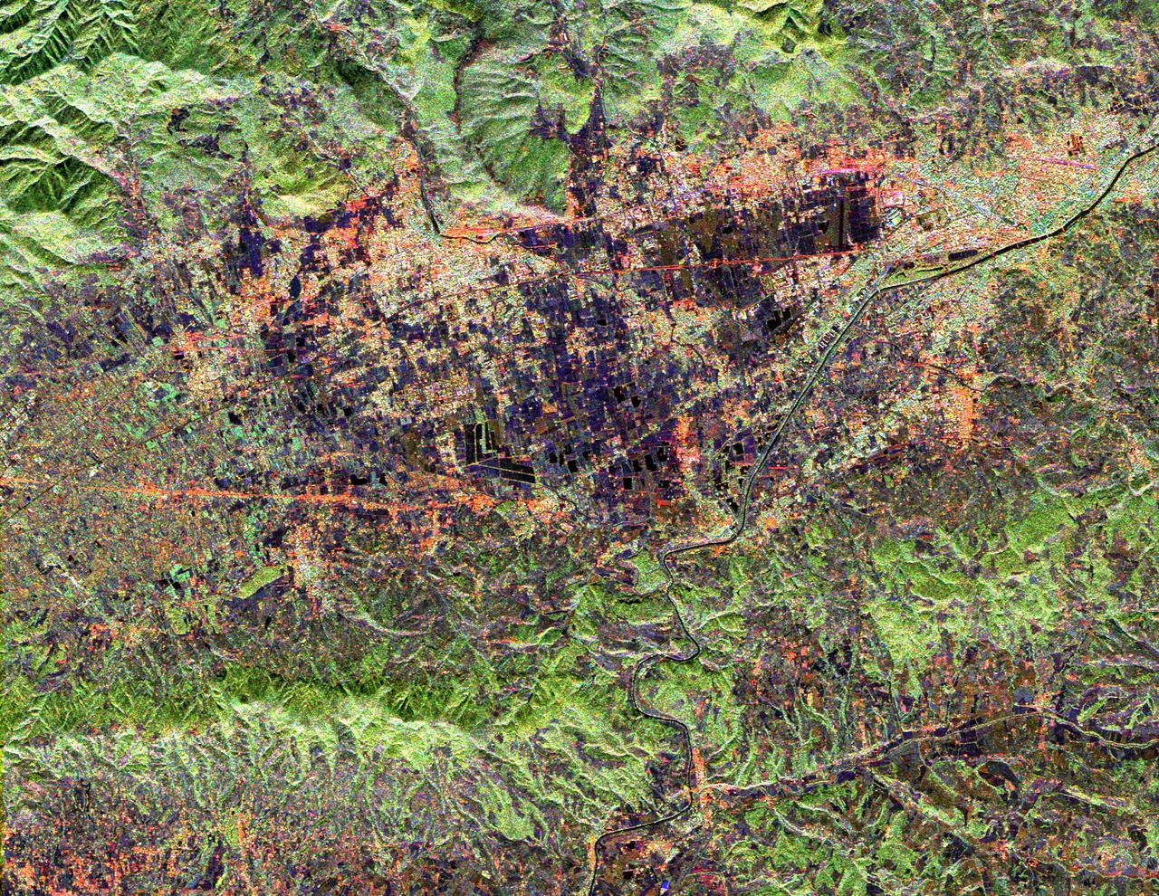 This radar image shows land use patterns in and around the city of Florence, Italy, shown here in the center of the image. Florence is situated on a plain in the Chianti Hill region of Central Italy. The Arno River flows through town and is visible as the dark line running from the upper right to the bottom center of the image. The city is home to some of the world's most famous art museums. The bridges seen crossing the Arno, shown as faint red lines in the upper right portion of the image, were all sacked during World War II with the exception of the Ponte Vecchio, which remains as Florence's only covered bridge. The large, black V-shaped feature near the center of the image is the Florence Railroad Station.  This image was acquired by the Spaceborne Imaging Radar-C/X-band Synthetic Aperture Radar (SIR-C/X-SAR) onboard the Space Shuttle Endeavour on April 14, 1994. SIR-C/X-SAR, a joint mission of the German, Italian, and United States space agencies, is part of NASA's Mission to Planet Earth. This image is centered at 43.7 degrees north latitude and 11.15 degrees east longitude with North toward the upper left of the image. The area shown measures 20 kilometers by 17 kilometers (12.4 miles by 10.6 miles). The colors in the image are assigned to different frequencies and polarizations of the radar as follows: red is L-band horizontally transmitted, horizontally received; green is L-band horizontally transmitted, vertically received; blue is C-band horizontally transmitted, vertically received.   http://photojournal.jpl.nasa.gov/catalog/PIA01795