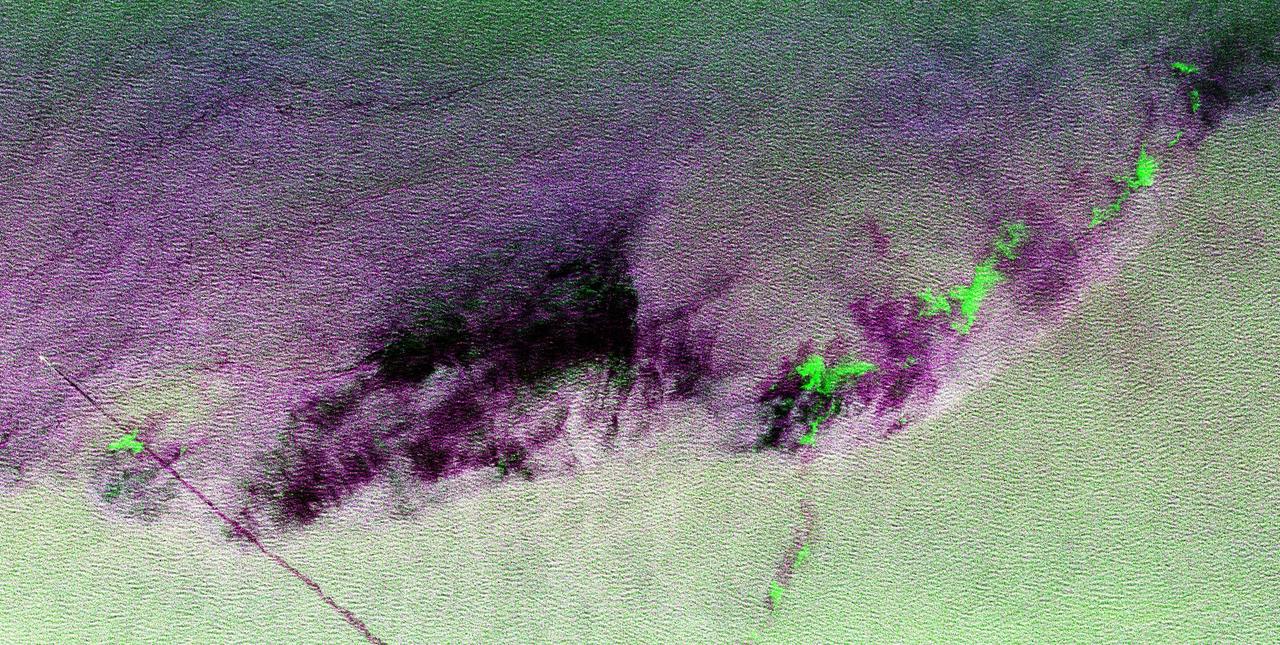 This is a radar image showing surface features on the open ocean in the northeast Atlantic Ocean. There is no land mass in this image. The purple line in the lower left of the image is the stern wake of a ship. The ship creating the wake is the bright white spot on the middle, left side of the image. The ship's wake is about 28 kilometers (17 miles) long in this image and investigators believe that is because the ship may be discharging oil. The oil makes the wake last longer and causes it to stand out in this radar image. A fairly sharp boundary or front extends from the lower left to the upper right corner of the image and separates two distinct water masses that have different temperatures. The different water temperature affects the wind patterns on the ocean. In this image, the light green area depicts rougher water with more wind, while the purple area is calmer water with less wind. The dark patches are smooth areas of low wind, probably related to clouds along the front, and the bright green patches are likely due to ice crystals in the clouds that scatter the radar waves. The overall "fuzzy" look of this image is caused by long ocean waves, also called swells. Ocean radar imagery allows the fine detail of ocean features and interactions to be seen, such as the wake, swell, ocean front and cloud effects, which can then be used to enhance the understanding of ocean dynamics on smaller and smaller scales.  The image is centered at 42.8 degrees north latitude, 26.2 degrees west longitude and shows an area approximately 35 kilometers by 65 kilometers (22 by 40 miles). The colors in the image are assigned to different frequencies and polarizations of the radar as follows: red is L-band horizontally transmitted, horizontally received; green is C-band horizontally transmitted, horizontally received; blue is L-band vertically transmitted, vertically received. This image was acquired by the Spaceborne Imaging Radar-C/X-band Synthetic Aperture Radar (SIR-C/X-SAR) imaging radar when it flew aboard the space shuttle Endeavour on April 11, 1994. SIR-C/X-SAR, a joint mission of the German, Italian and United States space agencies, is part of NASA's Mission to Planet Earth.   http://photojournal.jpl.nasa.gov/catalog/PIA01799