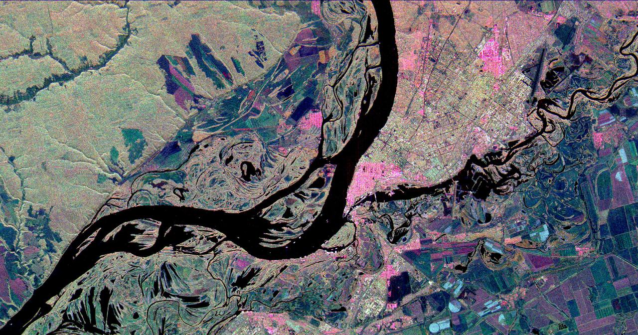 This three-frequency space radar image shows the city of Samara, Russia in pink and light green right of center. Samara is at the junction of the Volga and Samara Rivers approximately 800 kilometers 500 miles southeast of Moscow.