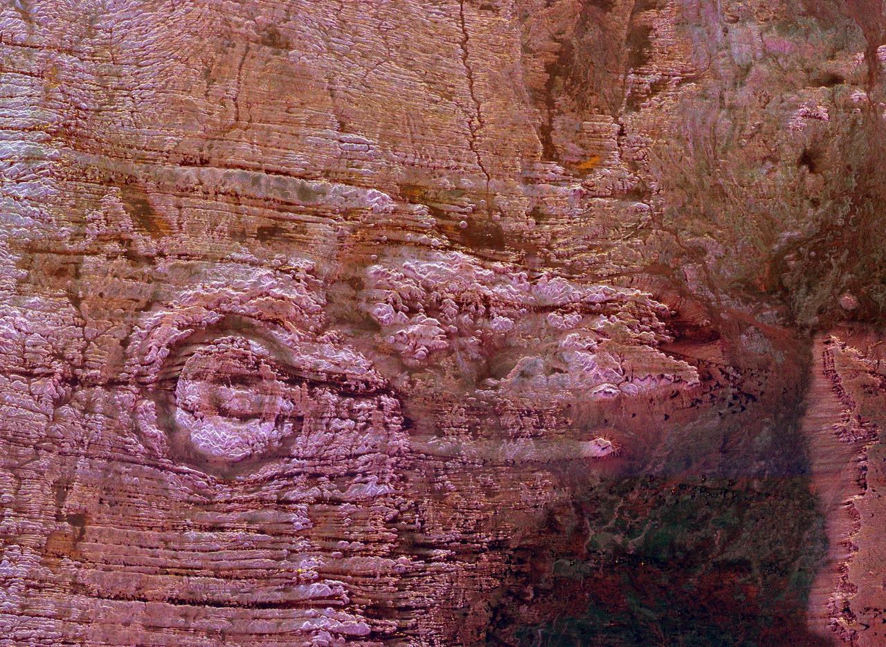 The impact of an asteroid or comet several hundred million years ago left scars in the landscape that are still visible in this spaceborne radar image of an area in the Sahara Desert of northern Chad.