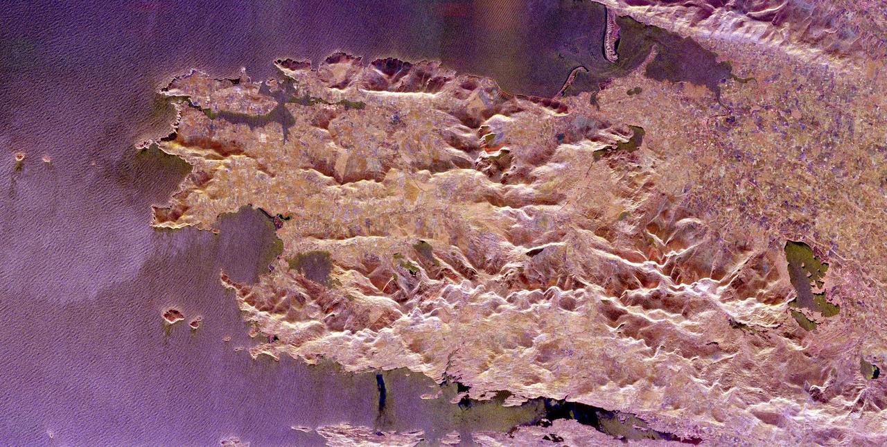 The Iveragh Peninsula, one of the four peninsulas in southwestern Ireland, is shown in this spaceborne radar image. The lakes of Killarney National Park are the green patches on the left side of the image.