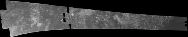 This image was obtained by NASA Cassini radar instrument during a flyby on Sept. 7, 2005. Southern Mid-latitudes Central Tsegihi, Mezzoramia. https://photojournal.jpl.nasa.gov/catalog/PIA01855