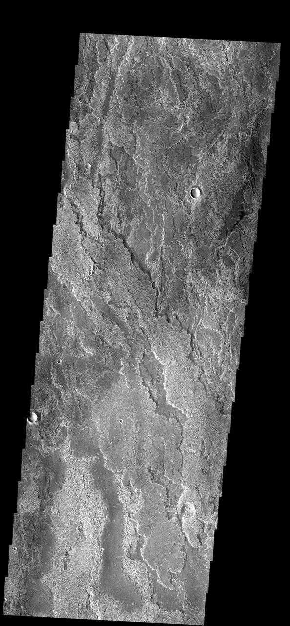 These layered volcanic flows originated from Arsia Mons as seen by NASA 2001 Mars Odyssey spacecraft.