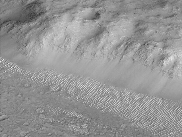 Layers of Cratered Highland Bedrock Exposed in Amenthes Slope