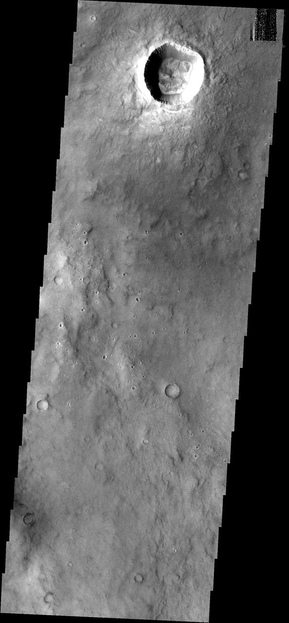 This crater and its interesting floor features is located south of  Meridiani Terra