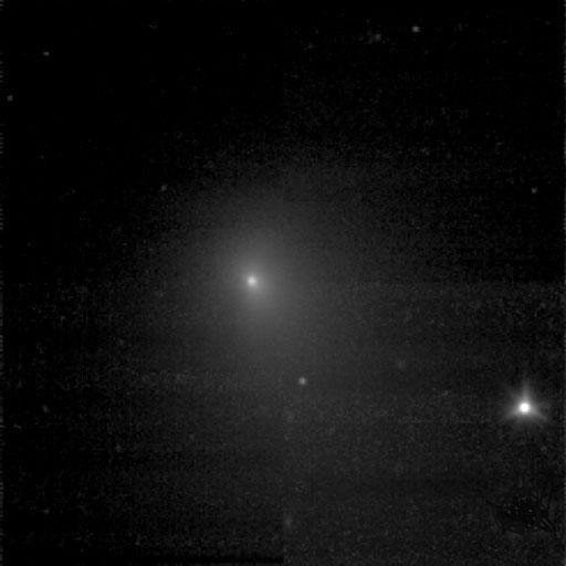 One of the two pictures of Tempel 1 (see also PIA02101) taken by Deep Impact's medium-resolution camera is shown next to data of the comet taken by the spacecraft's infrared spectrometer. This instrument breaks apart light like a prism to reveal the "fingerprints," or signatures, of chemicals. Even though the spacecraft was over 10 days away from the comet when these data were acquired, it detected some of the molecules making up the comet's gas and dust envelope, or coma. The signatures of these molecules -- including water, hydrocarbons, carbon dioxide and carbon monoxide -- can be seen in the graph, or spectrum.  Deep Impact's impactor spacecraft is scheduled to collide with Tempel 1 at 10:52 p.m. Pacific time on July 3 (1:52 a.m. Eastern time, July 4). The mission's flyby spacecraft will use its infrared spectrometer to sample the ejected material, providing the first look at the chemical composition of a comet's nucleus.  These data were acquired from June 20 to 21, 2005. The picture of Tempel 1 was taken by the flyby spacecraft's medium-resolution instrument camera. The infrared spectrometer uses the same telescope as the high-resolution instrument camera.   http://photojournal.jpl.nasa.gov/catalog/PIA02100