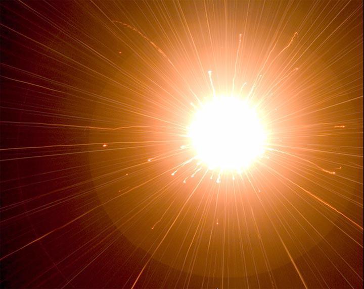 This image shows a flash produced in a laboratory by a high-velocity bead slamming into dust. Scientists at Ames Research Center say that the collision between Deep Impact impactor and comet Tempel 1 may have produce a similar flash.