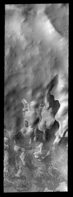 These bright and dark markings occurred near the end of summer in the south polar region. The dark material is likely dust that has been freed of frost cover