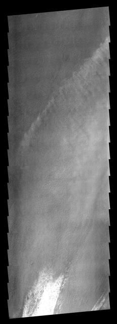 These clouds formed in the south polar region. The faintness of the cloud  system likely indicates that these are mainly ice clouds, with relatively  little dust content