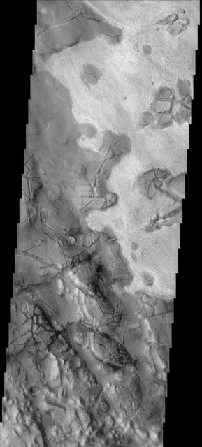 This image of part of Aram Chaos shows two different surface textures with distinctly different brightnesses. The lighter layer appears to be on top therefore younger than the darker surface