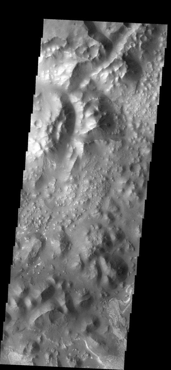 This type of broken-up terrain is called chaos. At the bottom right corner of the image there is evidence of deposition of material.