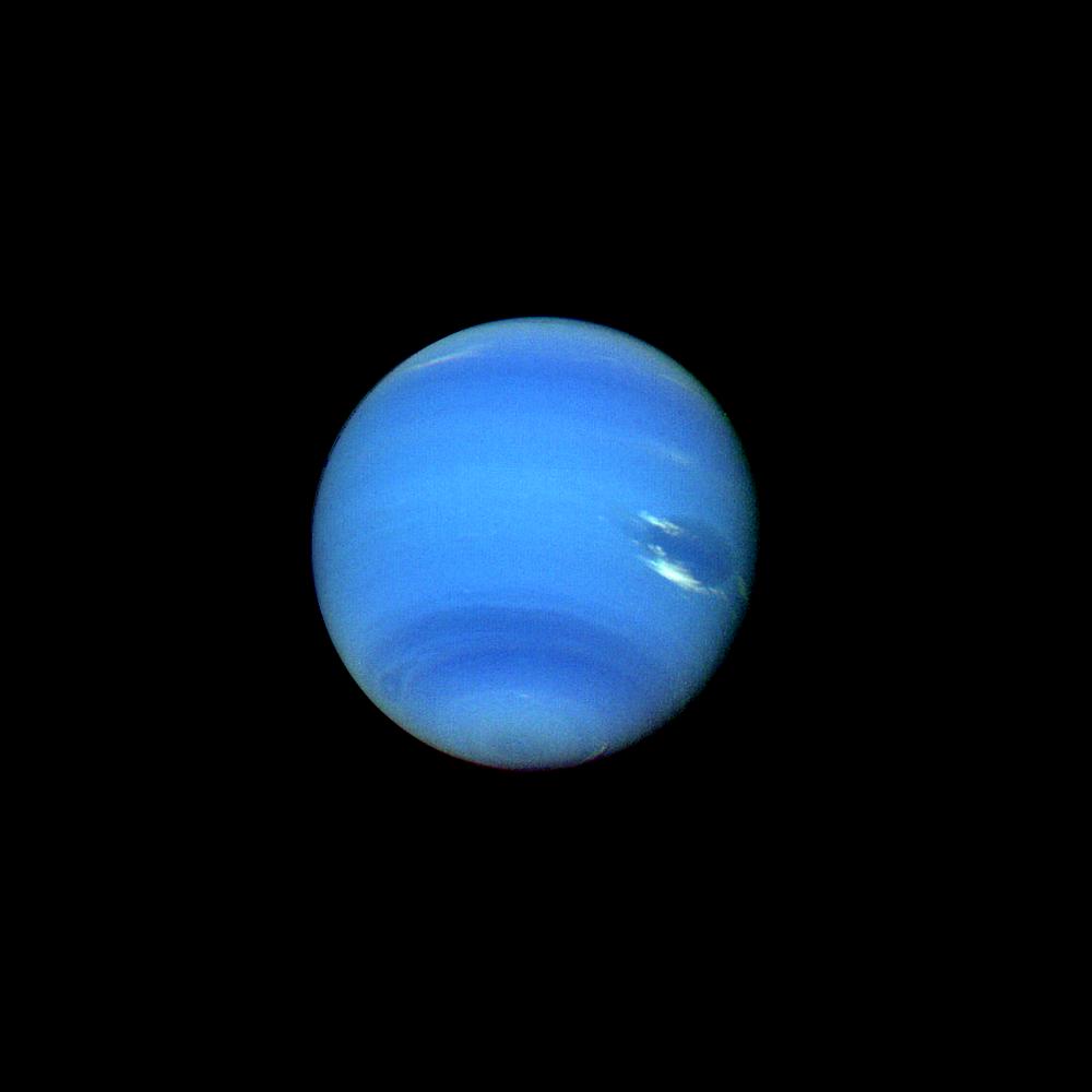 This contrast enhanced color picture of Neptune was acquired by NASA Voyager 2 on Aug. 14, 1989. As Voyager 2 approached Neptune, rapidly increasing image resolution is revealed striking new details. Bright, wispy clouds are seen overlying the Great Dar