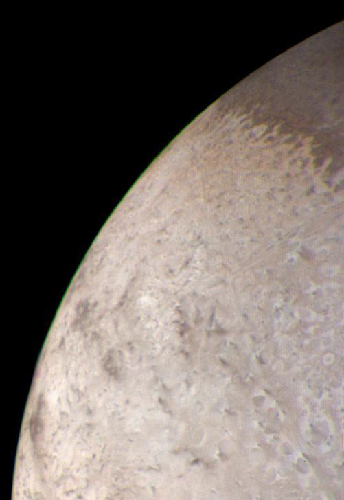 This natural color image of the limb of Triton was taken early in the morning of Aug. 25 1989, when the Voyager 2 spacecraft was at a distance of about 210,000 kilometers 128,000 miles from the icy satellite.