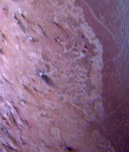 This false color image of Triton is a composite of images taken through the violet, green and ultraviolet filters. The image was taken early on Aug. 25, 1989 when Voyager 2 was about 190,000 kilometers 118,000 miles from Triton surface.