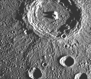 This crater illustrates the narrow hummocky rim facies, radial ridges, and surrounding extensive field of secondary craters. This image of Mercury was taken by NASA Mariner 10.