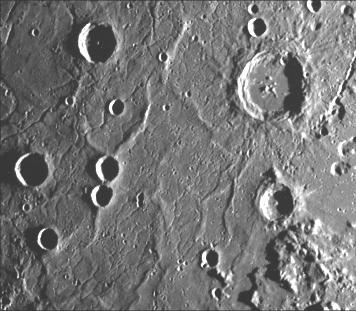 This image, from NASA Mariner 10 spacecraft which launched in 1974, includes part of the floor of the Caloris basin showing the ridges and fractures.  